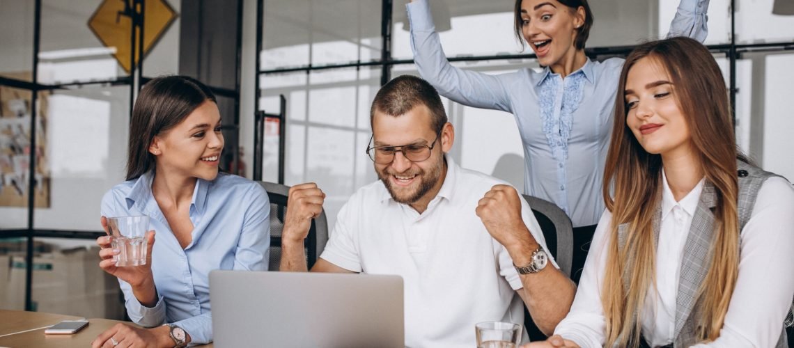 Group of people working out business plan in an office
